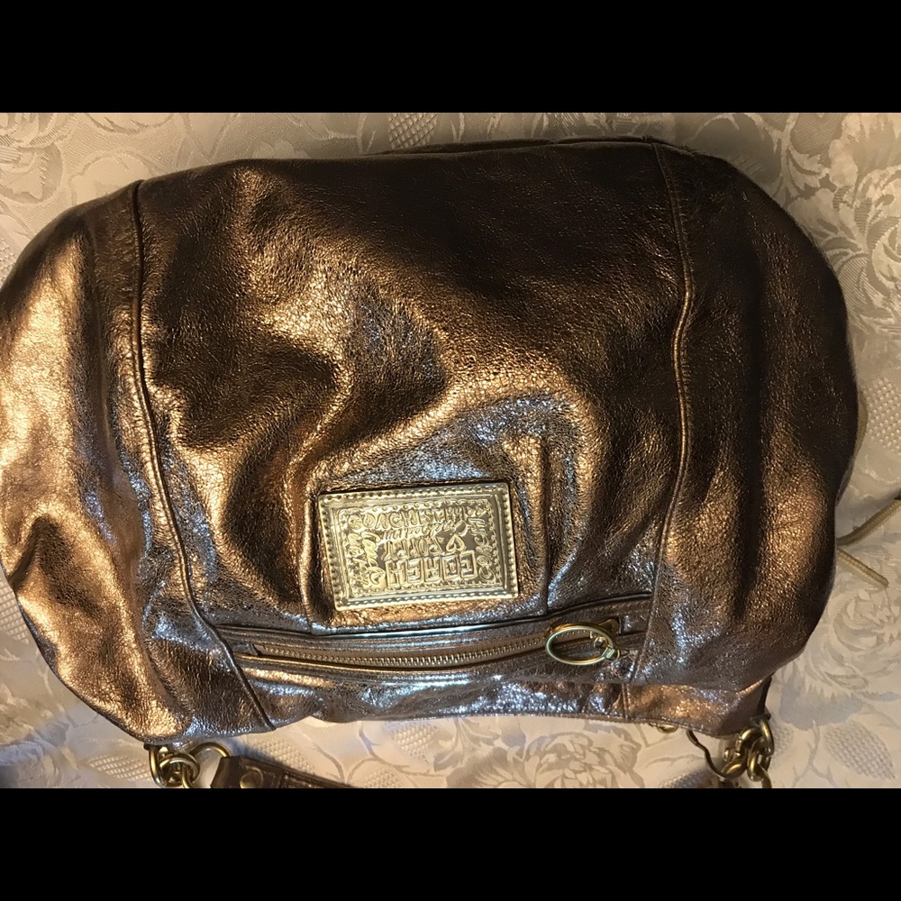Gold coach bag